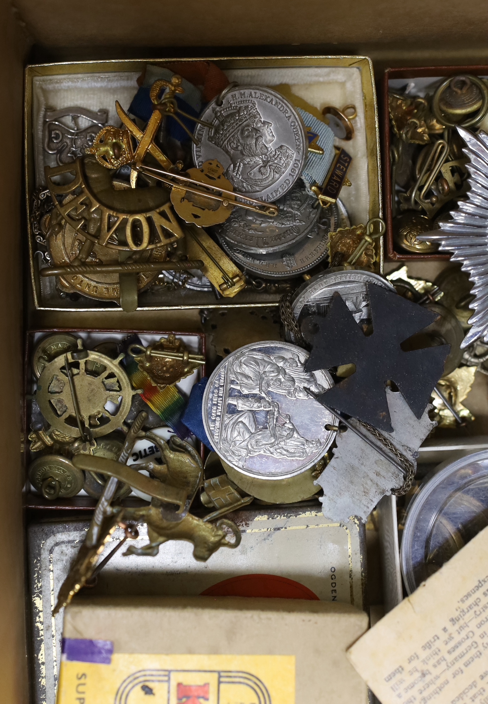 A 15ct. and enamel Tank Corps brooch, a quantity of military cap badges, and buttons, Lusitania medal, other medals, etc.